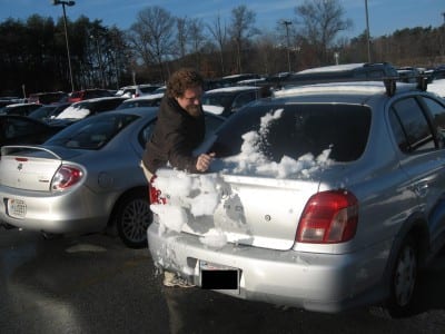 ben with snow on car