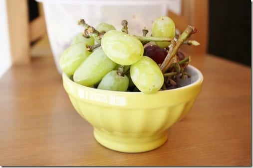 grapes in yellow bowl