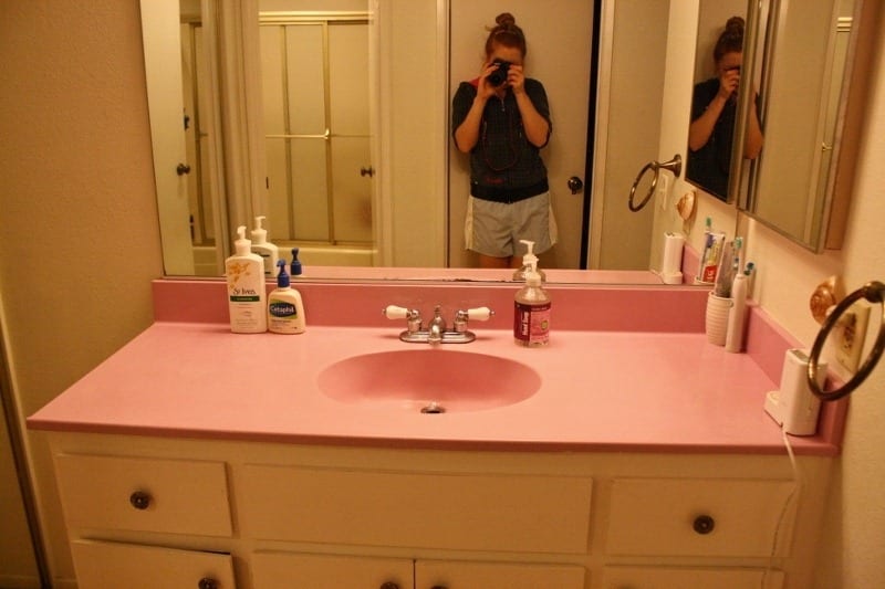 white 1969 tiles and pink sink in bathroom