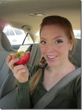 eating an apple in the car