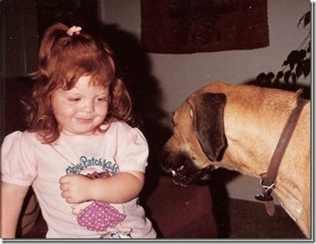 red head with dogs