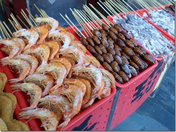 eating shrimp on a stick in china food blog