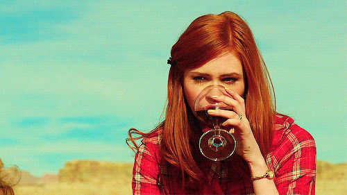 red head girl drinking